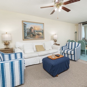 Unwind in the spacious living area, enjoying coastal views while curling up with a good book or streaming your favorite show