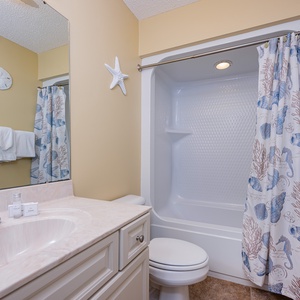 Refresh and rejuvenate in this guest bath, surrounded by beach decor that enhances your morning routine