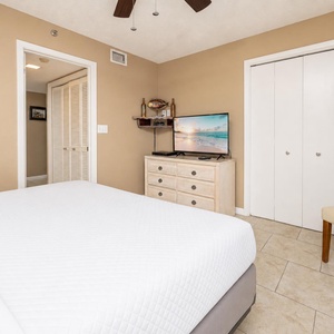 In the guest suite with queen bed, unwind with your favorite shows playing on the flat-screen TV nearby