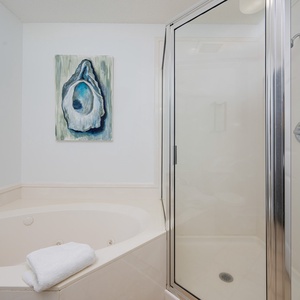 Indulge in relaxation in the master bath with a refreshing walk-in shower and soothing jetted tub