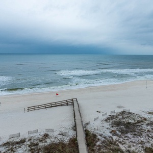 Experience breathtaking views of the serene shoreline from your private balcony, perfect for relaxation and unwinding