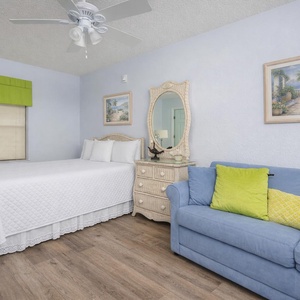 Sink into the plush sofa with a queen sleeper in this guest suite with a cozy queen bed