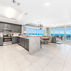 Admire the beachfront from this elegant kitchen space with stainless appliances and sleek cabinetry