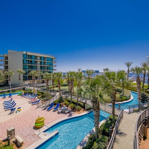 Experience stunning views of the bay, marina, pool area, and lazy river from your balcony