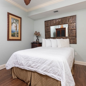 Drift into comfort in the queen guest suite, surrounded by charming decor that invites peaceful relaxation