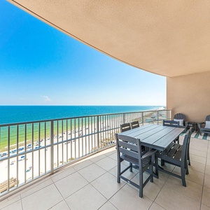 Rest at the outdoor table and listen to waves as the beachfront and gulf stretch ahead