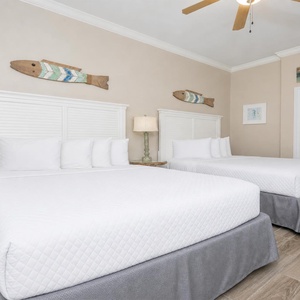 Experience restful nights on the queen beds in the guest suite, surrounded by charming coastal decor that invites relaxation