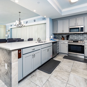 Upgrade your culinary experience in this stylish kitchen with modern stainless appliances and elegant design