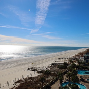 Experience seemingly endless coastline views of the horizon as waves lap the shore and the sun glistens over the water