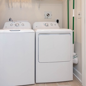 Load the top-loading washer, set a cycle, and refresh your beach attire in your rental for convenience