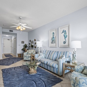 Find your perfect spot on the comfy couch to unwind, enjoying family time or a movie night amidst coastal decor