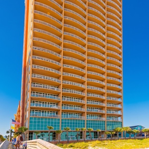 Spend a day at the beach with the gentle waves, soft white sand, and nearby palm trees at Phoenix Gulf Shores