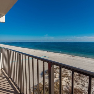 Enjoy stunning beachfront views from this inviting balcony with comfortable seating