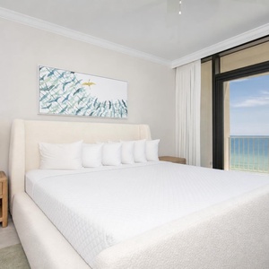 Inviting master bedroom on the beach with stylish decor and stunning beachfront views