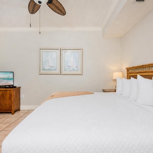 Unwind in the king bed in the guest room, where restful nights await and vacation fun begins
