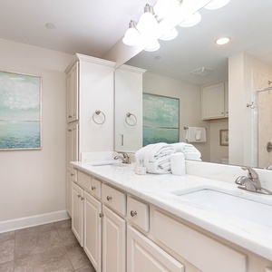 Refresh in this master bathroom, where a refreshing shower and fluffy towels await after a day at the beach