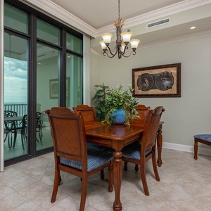Gather around the elegant dining table, enjoying meals and laughter while soaking in coastal views
