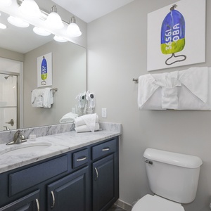 Freshen up in this guest bath in the relaxing shower or soothing tub before an exciting beach day