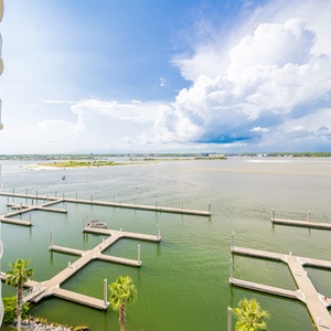 Serene waters and docks framed by lush palm trees, perfect for a relaxing getaway