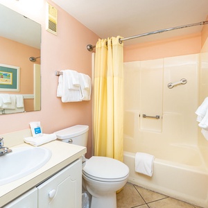 Refresh yourself in the guest bathroom, where soft towels await after a day of beach fun