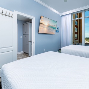 Unwind in this queen guest suite and stream your favorite shows or enjoy a good movie after a beach day