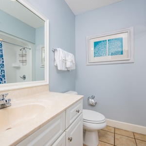 Freshen up in this guest bath in the relaxing shower or soothing tub before an exciting day