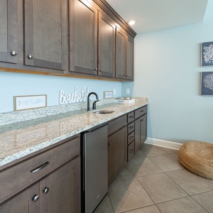 Mix drinks at the wet bar while enjoying coastal decor and the relaxed atmosphere inviting you to unwind