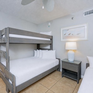 Perfect for storytelling with family before sleep, this charming bunk room invites a restful night