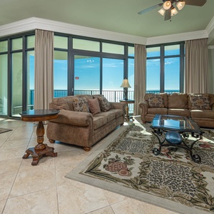 Relax on the cozy sofa with a queen sleeper in this inviting family room with breathtaking beachfront views