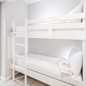 Discover two bunk beds in the hallway for kids, perfect for creating little beach adventures