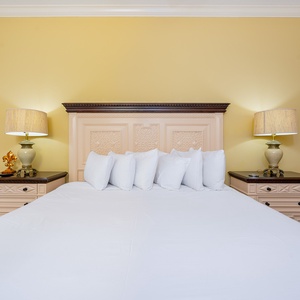 Sink into the soft, king bed, surrounded by warm lighting, and let relaxation embrace you in this cozy guest suite