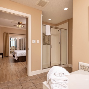 Indulge in relaxation in the master bath with a refreshing walk-in shower and soothing jetted tub