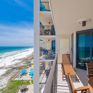 Sunlight warms your balcony as you lounge watching colorful umbrellas dotting the beach