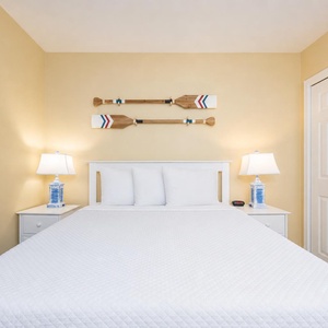 Calm yellow walls and coastal paddles set a serene mood in the suite for restful nights and mornings