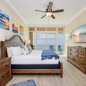 Wood accents frame the king bed in the master suite where you unwind watching a movie after a coast day