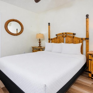 Classic bamboo furnishings add charm to the queen guest suite where you can unwind after a day of adventure