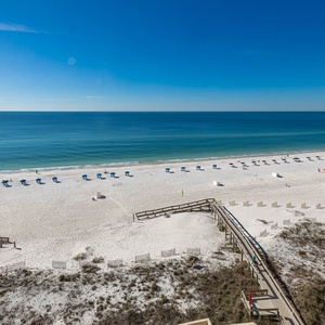 Experience breathtaking views from the balcony overlooking the pristine beach, perfect for relaxation and enjoyment