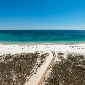 Gaze out at the stunning beach from the balcony, where the gentle sounds of the surf create a serene escape
