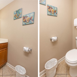 Additional half bath featuring a spacious vanity, decorative art, and soft towels for your comfort