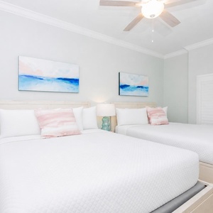 Relax on one of the cozy queen beds in this guest suite and enjoy a peaceful slumber