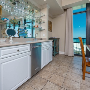 Mix up your favorite drinks at the wet bar, while soaking in the stunning coastal views from your balcony