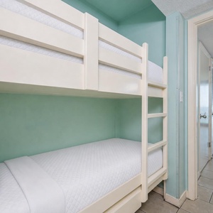 Bunk beds in the sleeping area offer a cozy spot for the kids after fun-filled days along the coast