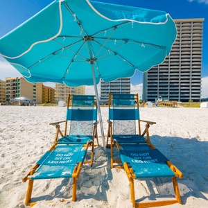 Relax on the soft, white sand with beach chairs and umbrellas set up for a perfect day by the water