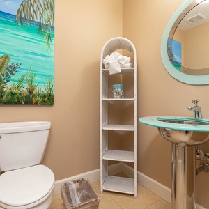 Additional half bath with stylish coastal accents for a refreshing start to your day