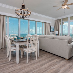 Unwind in the living space with stunning panoramic beach views, where comfort meets coastal charm