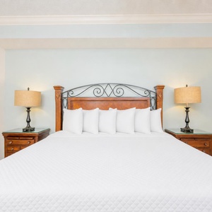 Relax after a day of adventure in the master suite with a plush king bed adorned with fluffy pillows