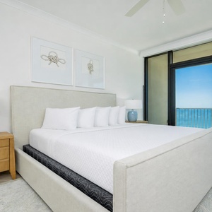 Soothing master suite featuring a plush king bed for resting peacefully with the sights and sounds of the coast