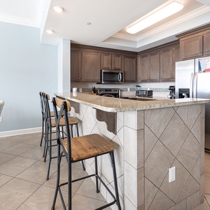 Wake up with morning coffee at the breakfast bar and get ready for a beach day in this stylish space