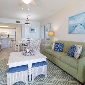 Relax on the comfortable sofa with queen sleeper, coastal décor, and enjoy the inviting vibe of the living space