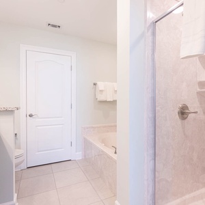 Indulge in relaxation in the soothing jetted tub or refreshing walk-in shower in the master bath